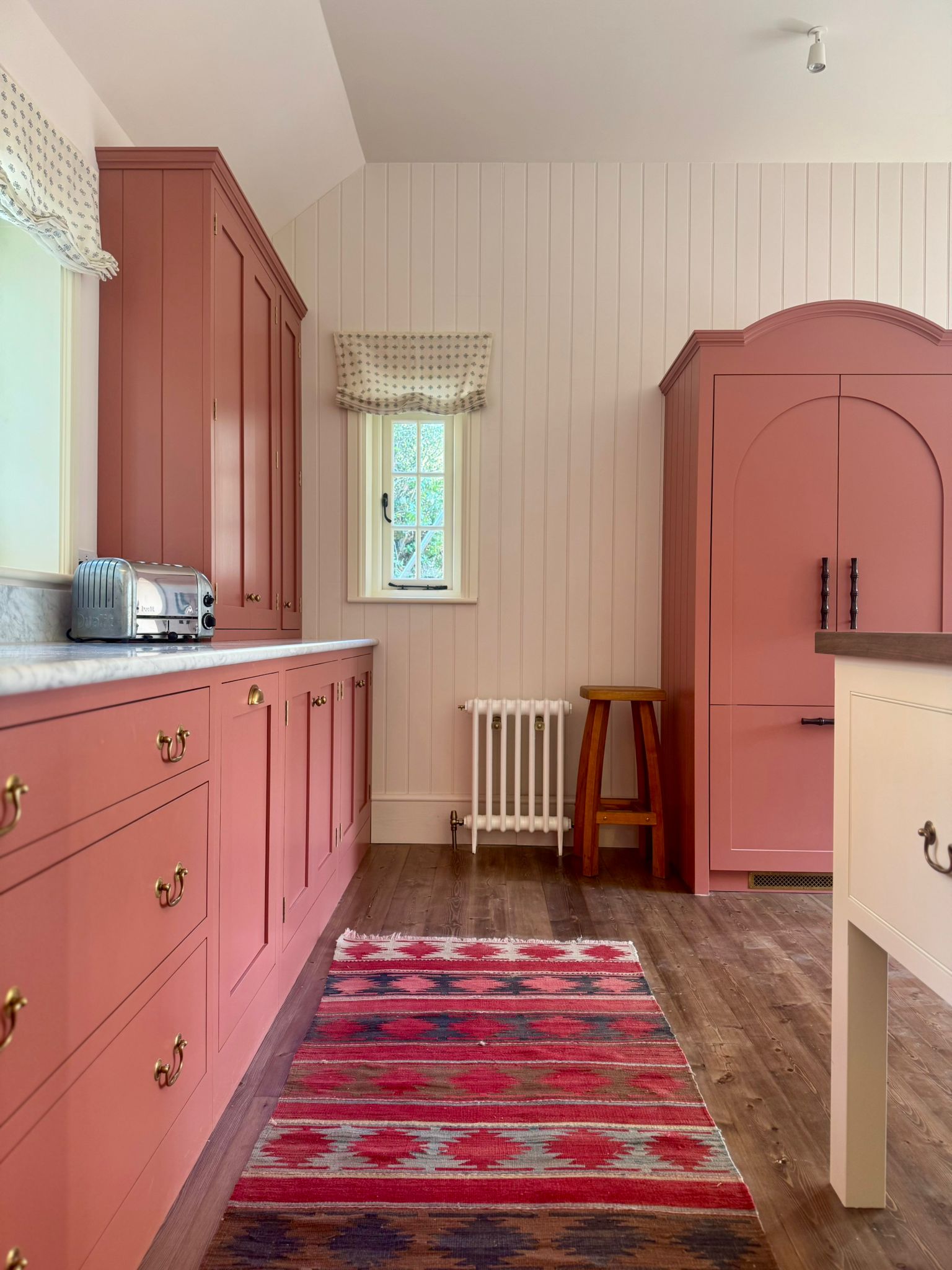 Kitchen corridor with an arched pantry cupboard