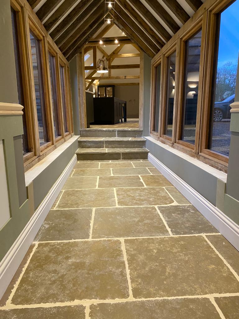 Oak-frame garden-room corridor with painted panelling