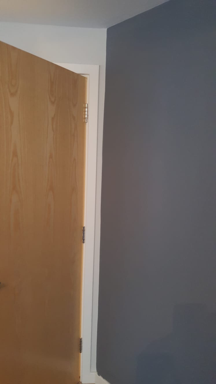 Room mid-decoration with dust sheets and a stepladder
